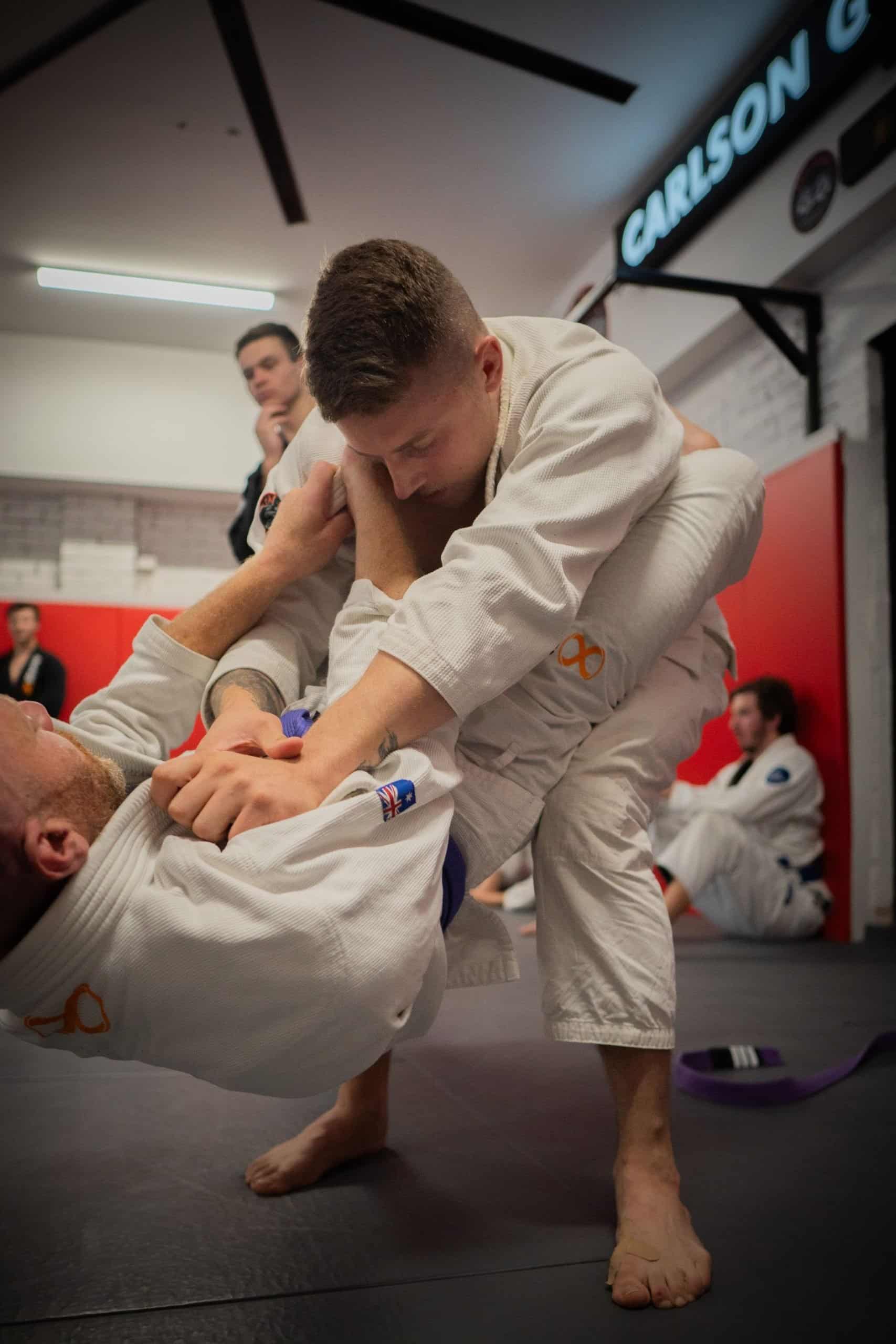 Gi BJJ class students drilling techniques at Carlson Gracie Melbourne
